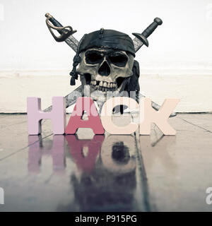 skull and crossbones with the word HACK on a old wooden floor with reflection Stock Photo