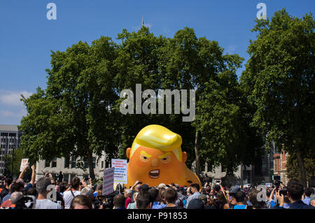 London, UK, 13 July 2018. Baby Trump blimp launched on Parliament Square in London, during Donald Trump visit in the UK Credit: Alexey Moskvin/Alamy Live News Stock Photo