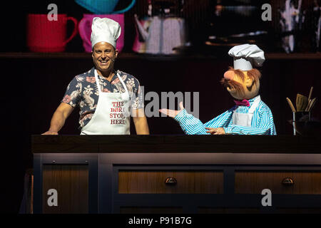The O2 Arena, UK. 13th July 2018,Swedish Chef and guest Kevin Bishop cooking during a segment At The Muppets Take The O2, Peninsula Square, London. © Jason Richardson / Alamy Live News Stock Photo