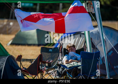 Suffolk, UK, 13 July 2018. Sleeping off the night before an exhausted England fan - The 2018 Latitude Festival, Henham Park. Suffolk 14 July 2018 Credit: Guy Bell/Alamy Live News Stock Photo