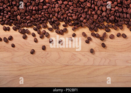 Coffee beans wood background border Stock Photo