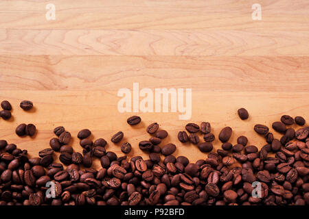 Coffee beans wood background border Stock Photo