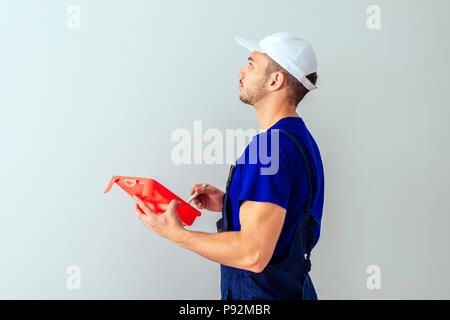 Adult man prepare for paint his room while mixing the color Stock Photo