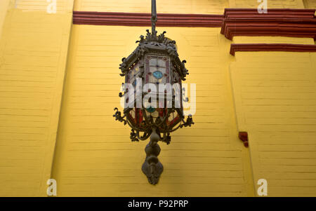 Old lantern with stained glass stained glass. Barrio Santa Cruz, Seville, Spain (Sevilla - España) Stock Photo