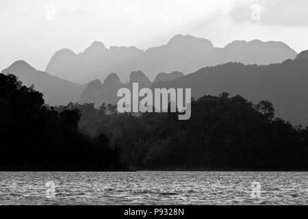 KARST FORMATIONS create an beautiful landscape around CHEOW EN LAKE in KHAO SOK NATIONAL PARK - THAILAND Stock Photo