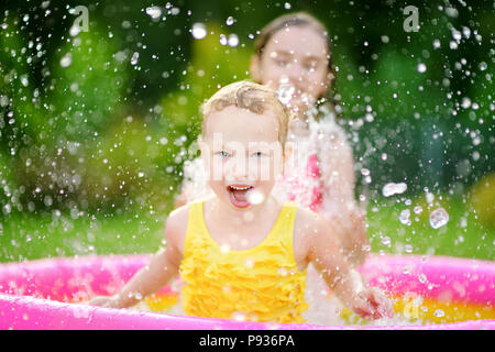 Adorable Little Girls Splashing In Tropical Shallow Water During Summer 