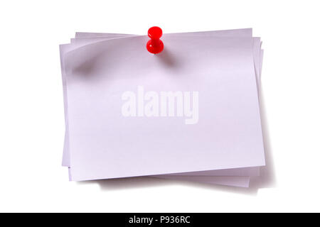 Several plain white sticky post notes with red pushpin Stock Photo