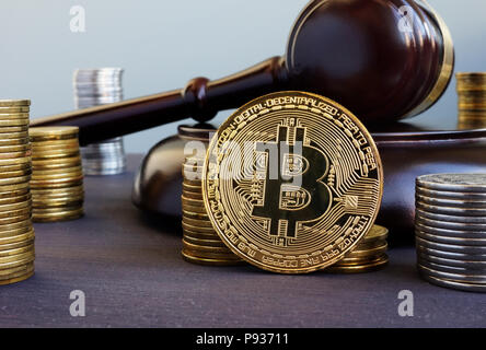 Cryptocurrency regulation. Bitcoin and gavel on a desk. Stock Photo