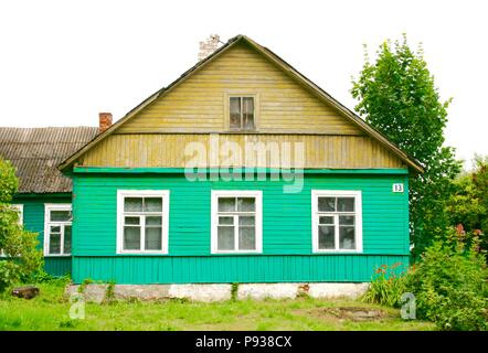 Traditional green and yellow wooden karaim house with three windows in Trakai, Vilnius, Lithuania Stock Photo