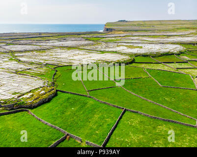 Aerial view of Inishmore or Inis Mor, the largest of the Aran Islands in Galway Bay, Ireland. Famous for its strong Irish culture, loyalty to the Iris Stock Photo