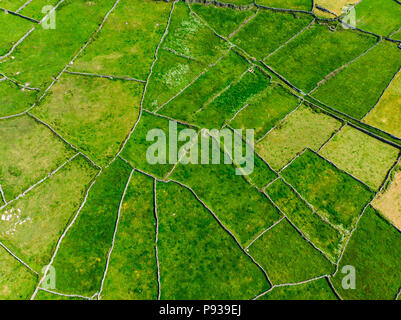 Aerial view of Inishmore or Inis Mor, the largest of the Aran Islands in Galway Bay, Ireland. Famous for its strong Irish culture, loyalty to the Iris Stock Photo