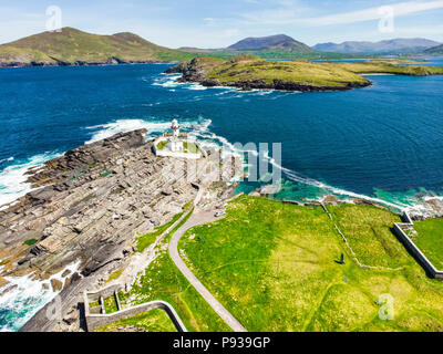 Beautiful view of Valentia Island Lighthouse at Cromwell Point. Locations worth visiting on the Wild Atlantic Way. Scenic Irish countyside on sunny su Stock Photo