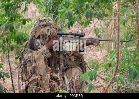 A Nigerian Army Special Forces Sniper Poses During A Demonstration Of ...