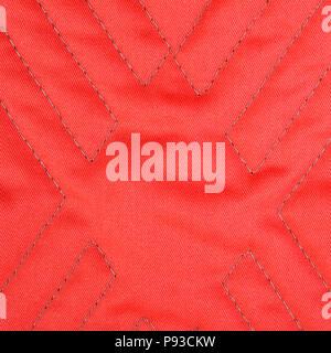 Red quilted fabric texture with geometric pattern Stock Photo