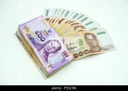 Pile of Thai money on white background Stock Photo