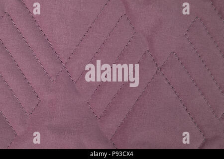 Brown quilted fabric texture with geometric pattern Stock Photo