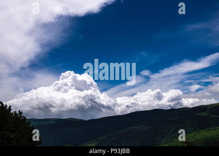 Cumulus clouds after rain over a ridge in the Catalonian Pyrenees, Spain Stock Photo