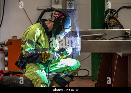 Welder wearing protective equipment welding Stock Photo