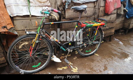 Bicycle leaning against wooden shacks, close up, Goma, Democratic Republic of Congo, Africa Stock Photo