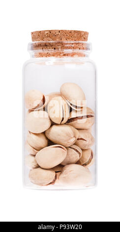 Pistachios in a glass bottle with cork stopper, isolated on whit Stock Photo
