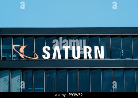 Berlin, Germany - july 2017: The logo of the consumer electronic retail store 'Saturn', in Berlin , Germany Stock Photo