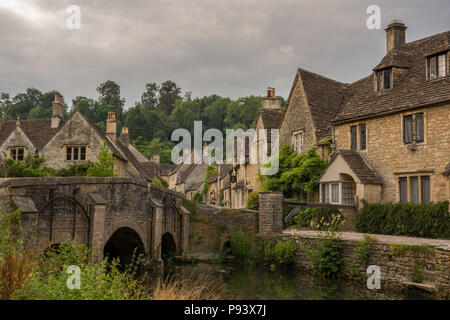 Stone cottages near Bybrook river, Castle Combe, village, Cotswolds, Wiltshire, England, United Kingdom, Europe. Classic view. Stock Photo