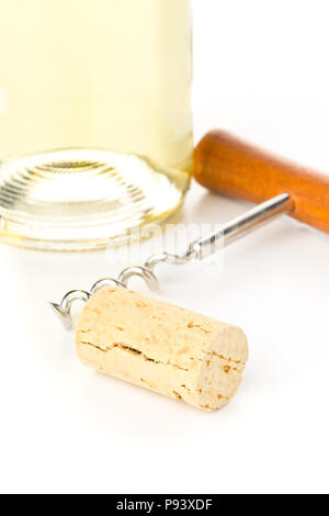 Brown natural wine cork with corkscrew and bottle of white wine on white background Stock Photo