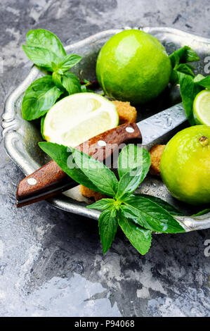 Mojito ingredients. Lime, mint and cane sugar Stock Photo