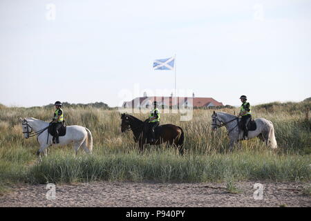 Police patrol the beach at the Trump Turnberry resort in South Ayrshire, where US President Donald Trump and first lady Melania Trump are spending the weekend. Stock Photo