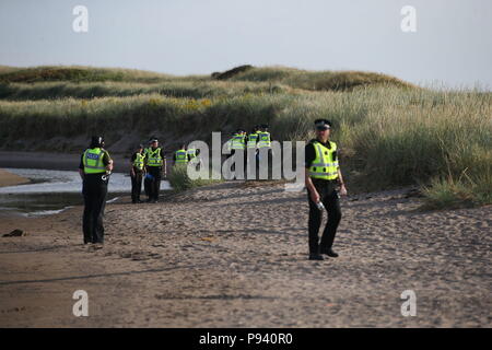 Police patrol the beach at the Trump Turnberry resort in South Ayrshire, where US President Donald Trump and first lady Melania Trump are spending the weekend. Stock Photo