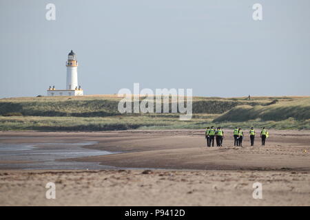 Police patrol the beach at the Trump Turnberry resort in South Ayrshire, where US President Donald Trump and first lady Melania Trump are spending the weekend. Stock Photo