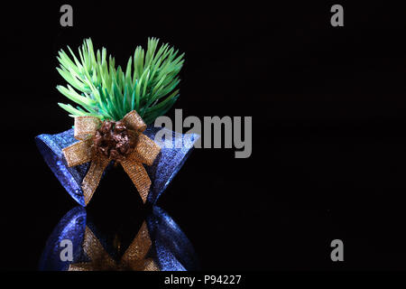 Nice blue Christmas bells with reverberation isolated on black background Stock Photo