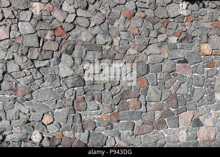Rubble gray and brown stone wall, rubblework. Stock Photo