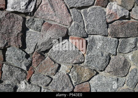 Rubble gray and brown stone wall, rubblework. Stock Photo