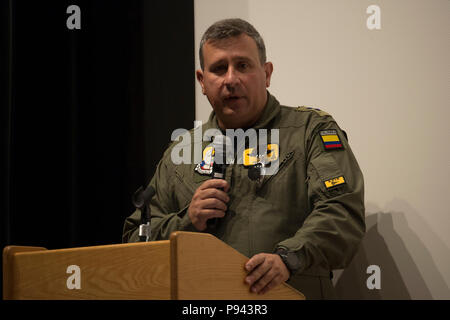 Colombian Air Force Brig. Gen. Pablo Garcia, Aerial Combat Command 1 commander, speaks to U.S. and Colombian Air Force members during an in-processing briefing at Davis-Monthan Air Force Base, Ariz., July 6, 2018. The Colombian Air Force will be participating in Red Flag 18-3.  Red Flag gives mission commanders the opportunity to lead in a contested, degraded and operationally limited environment with multi-domain assets and international partners in a safe training environment. (U.S. Air Force photo by Staff Sgt. Angela Ruiz) Stock Photo