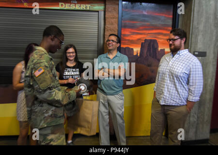 More than 400 Arizona Army National Guard Soldiers with 1st Battalion, 158th Infantry Regiment rally together with their families inside Wells Fargo Arena in Tempe, Arizona for an emotional farewell ceremony July 7, as the Battalion prepares for their deployment in support of Operation Spartan Shield (Photo by Army Sgt. 1st Class Robert Freese, released). Stock Photo