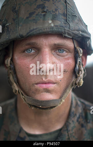 U.S. Marine Corps Rct. Douglas Wright, an 18-year-old native of Summerville, S.C., poses for a picture during Basic Warrior Training July 6, 2018 on Parris Island, S.C. Wright is with Platoon 2057, Echo Company, 2nd Recruit Training Battalion, and is scheduled to graduate Aug. 14, 2018. “I joined the Marines to be the best, I wanted to make a difference in my life and saw how the Marines carry themselves and hold themselves to a higher standard, and I wanted that,” said Wright. “One thing that has stood out to me about the training is the brotherhood of this platoon, we have gotten really tigh Stock Photo