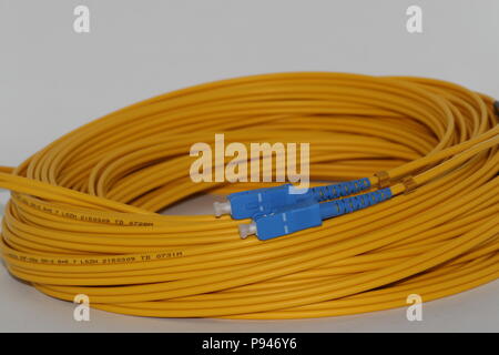 Capped Fiber optics SC connectors single mode patch cord , isolated on white background Stock Photo