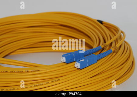 Open Fiber optics SC connectors single mode patch cord , isolated on white background Stock Photo