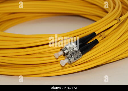 capped Fiber optics FC connectors patch cord , isolated on white background Stock Photo