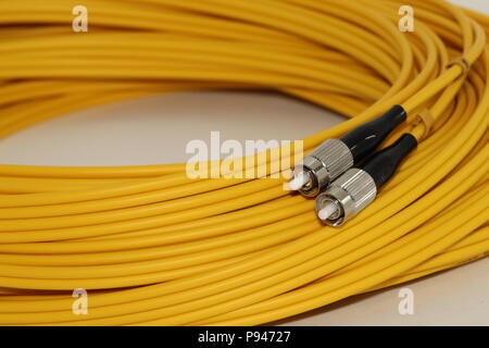 Opened Fiber optics FC connectors patch cord , isolated on white background Stock Photo