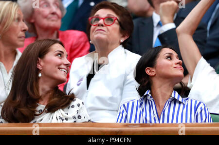 The Duchess of Cambridge and The Duchess of Sussex in the royal box on centre court on day twelve of the Wimbledon Championships at the All England Lawn Tennis and Croquet Club, Wimbledon. PRESS ASSOCIATION Photo. Picture date: Saturday July 14, 2018. See PA story TENNIS Wimbledon. Photo credit should read: Andrew Couldridge/PA Wire. Stock Photo