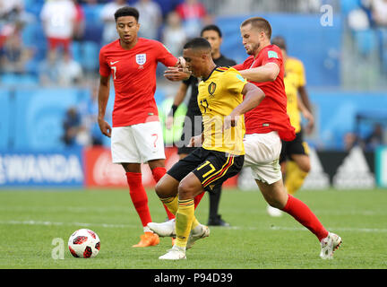 Belgium's Youri Tielemans (centre) and England's Eric Dier (right) battle for the ball during the FIFA World Cup third place play-off match at Saint Petersburg Stadium. Stock Photo