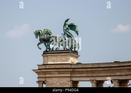 The statue of Peace on top of the right colonnade of the Millennium Monument in Heroes Square, Budapest. Stock Photo