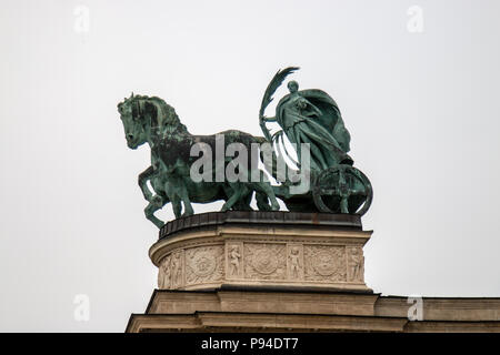 The statue of Peace on top of the right colonnade of the Millennium Monument in Heroes Square, Budapest. Stock Photo