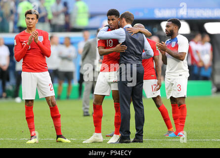 England manager Gareth Southgate embraces Marcus Rashford after the FIFA World Cup third place play-off match at Saint Petersburg Stadium. Stock Photo