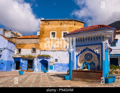 Public fountain of the Plaza El Hauta, square in medina of Chefchaouen Morocco Stock Photo
