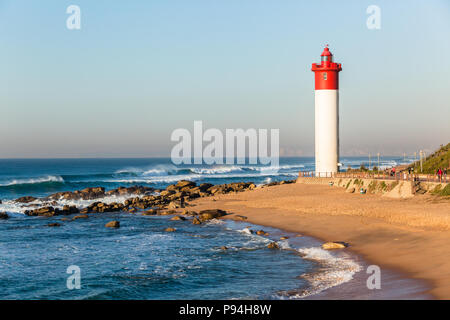 beach shoreline ocean closeup lighthouse backlight sunlight