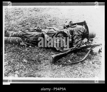 A German soldier, probably a sniper, laying on the ground Stock Photo