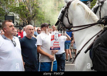 London UK 14th July 2018London UK 14th July 2018 'Free Tommy' (Robinson) and Trump supporters clash with police out side the Palace of Westminster. Credit: Thabo Jaiyesimi/Alamy Live News Stock Photo